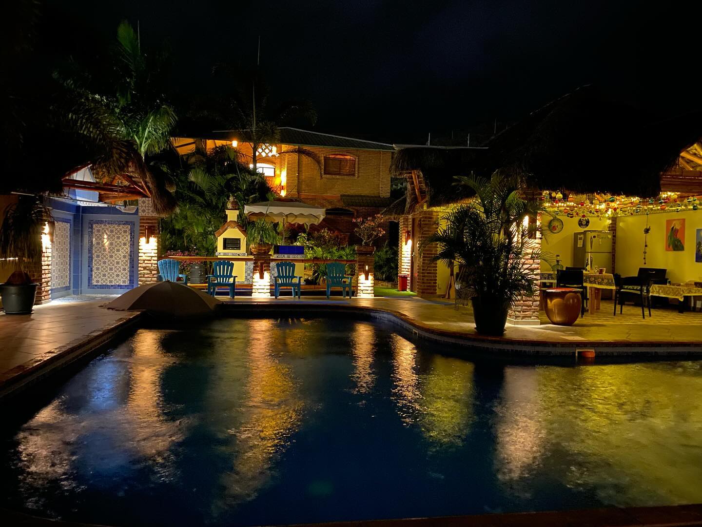 The villa at night.